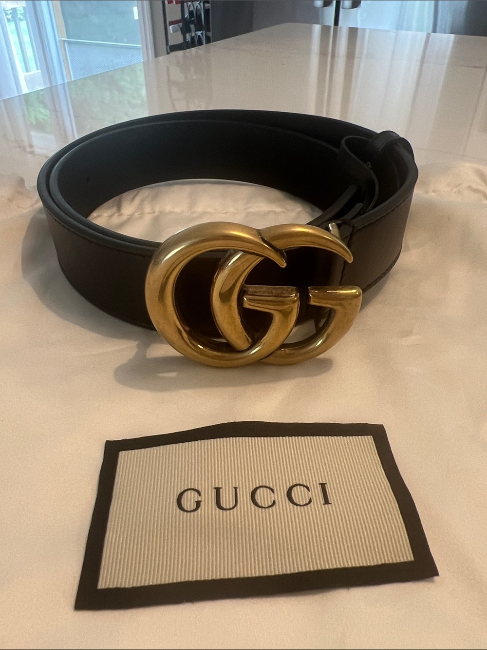 Gucci Black Leather Belt with Embossed Logo